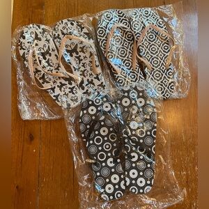 New in Package. Set of Three Patterned Flip Flops